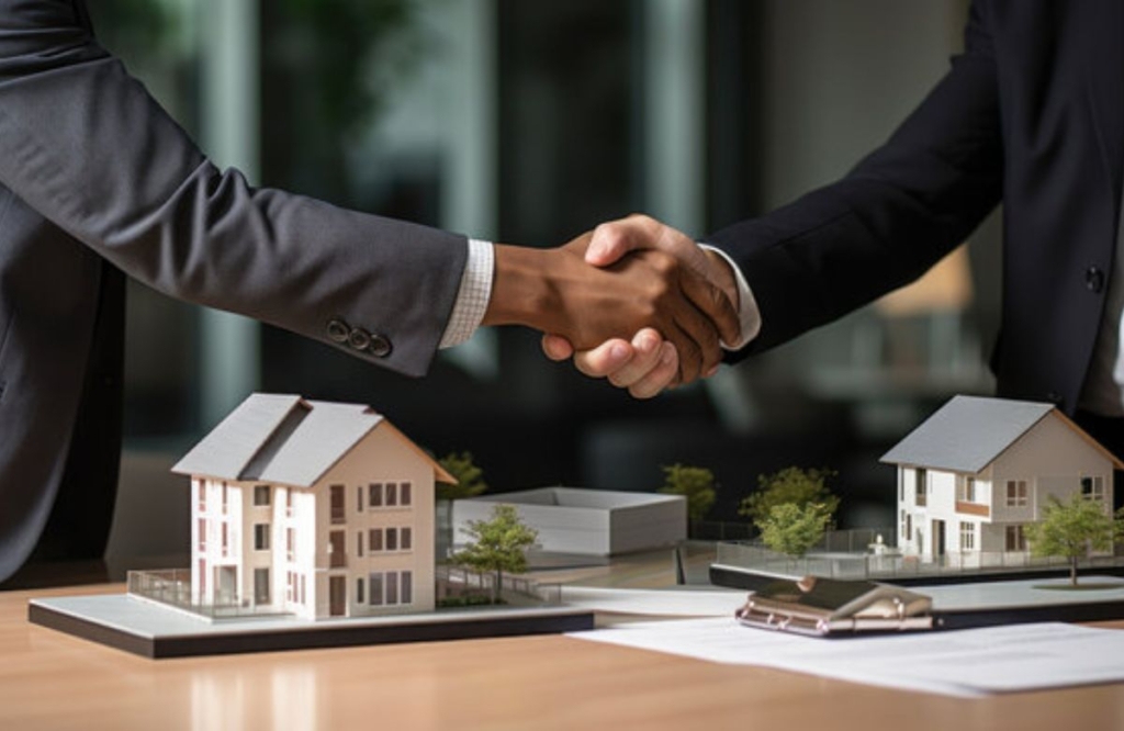 Two agent shake the hands after the invest on properties for future of life in Lahore.